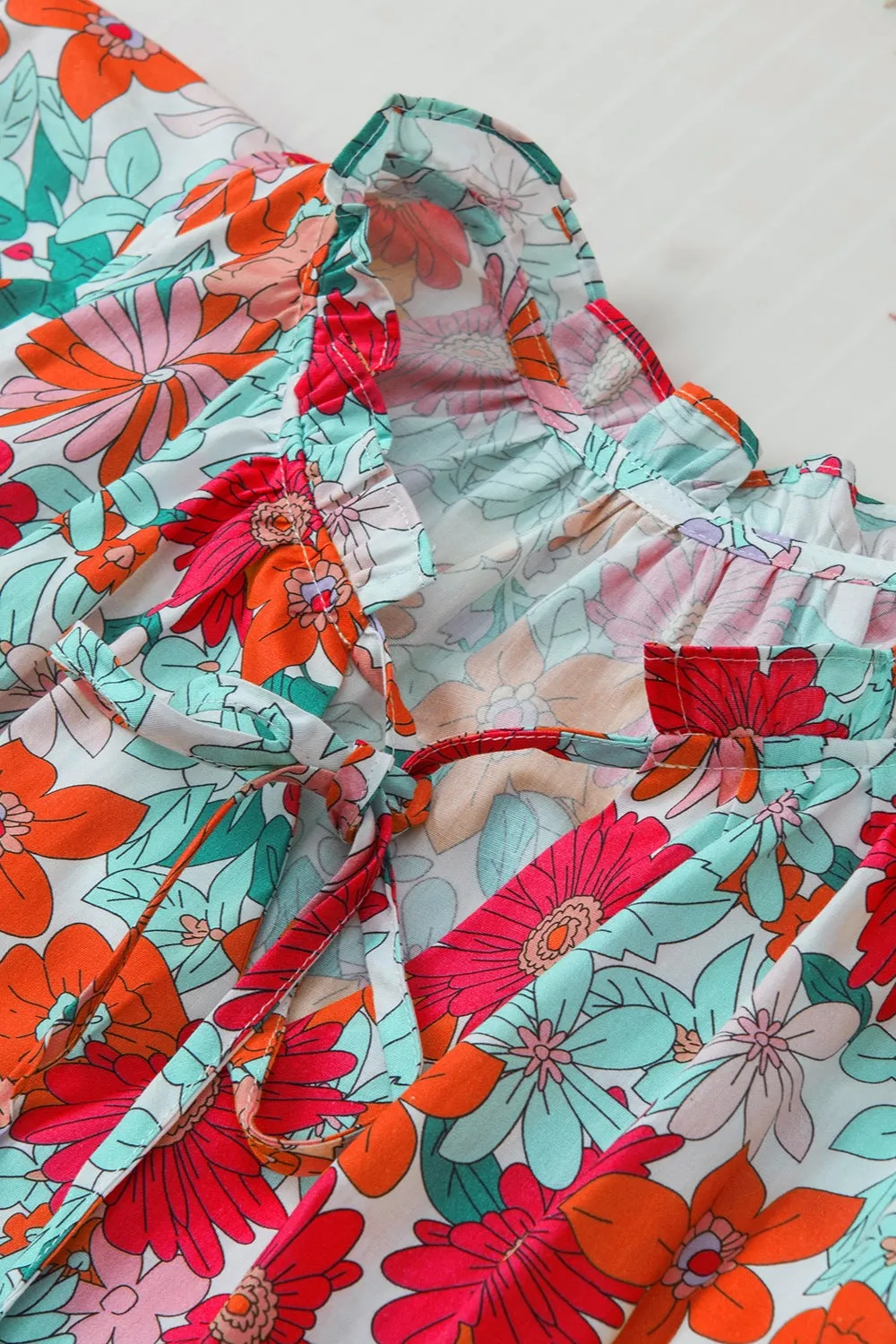 Hazel Blues® |  Ruffled Printed Tie Neck Cap Sleeve Blouse