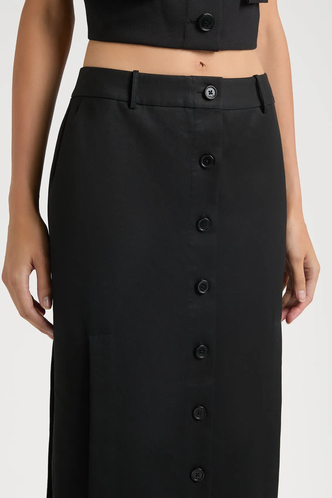 REFINED SKIRT SHOWCASING STYLISH CUT-OUT DETAILS AND BUTTON FEATURES